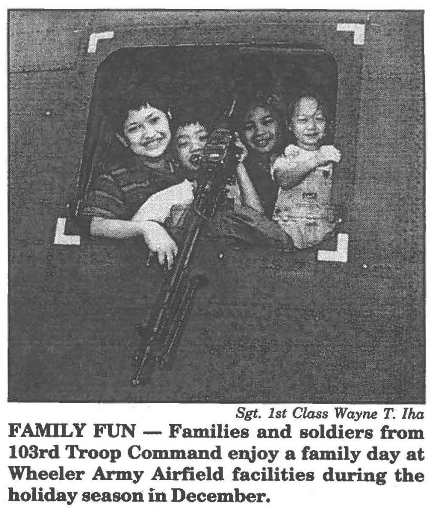 FAMILY FUN - Families and soldiers from 103rd Troop Command enjoy a family day at Wheeler Army Airfield facilities during the holiday season in December.