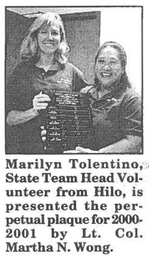 Marilyn Tolentino, State Team Head Volunteer from Hilo, is presented the perpetual plaque for 2000-2001 by Lt. Col. Martha N. Wong.
