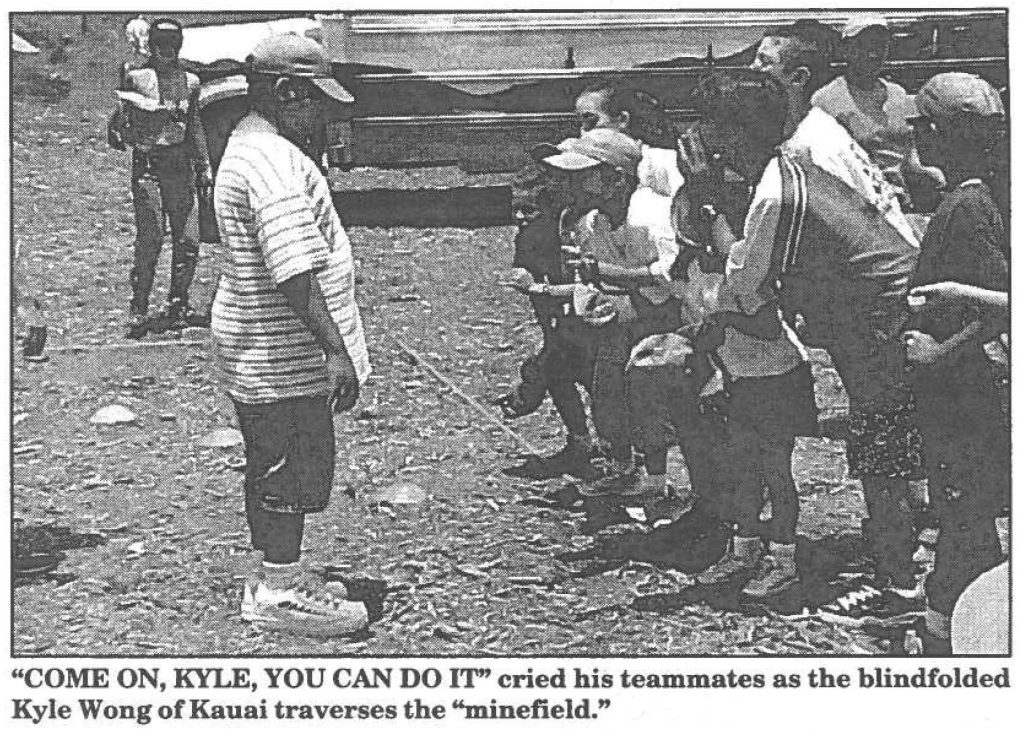 "COME ON, KYLE, YOU CAN DO IT" cried his teammates as the blindfolded Kyle Wong of Kauai traverses the "minefield!'