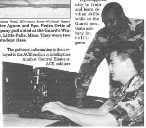 SPECIAL INTEL- Specialists Janal Jones (standing) and Rick Ishii, from the 229th Military Intelligence Company, train on the WARLORD notebook computer. The computer keeps the unit in sync with the Army's newer intelligence gathering systems.