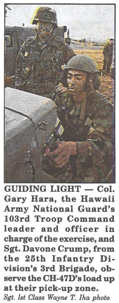 GUIDING LIGHT - Col. Gary Hara, the Hawaii Army National Guard's 103rd Troop Command leader and officer in charge of the exercise, and Sgt. Davone Crump, from the 25th Infantry Division's 3rd Brigade, observe the CH-47D's load up at their pick-up zone. Sgt. lst Class Wayne T. Iha photo