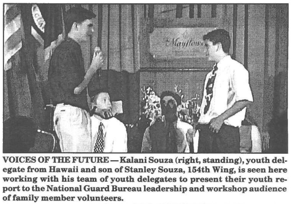 VOICES OF THE FUTURE- Kalani Souza (right, standing), youth delegate from Hawaii and son of Stanley Souza, 154th Wing, is seen here working with his team of youth delegates to present their youth report to the National Guard Bureau leadership and workshop audience of family member volunteers