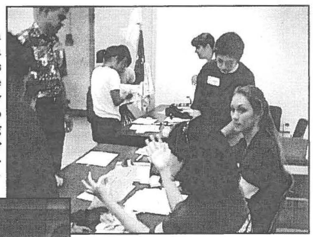 Checking in youth trainees at Kalaeloa and answering parents questions are State Team volunteers Missy Vincent, Gloria Duro and Bobbie Kito-Hong with junior leader Jazmin Morrill (1-487FA)