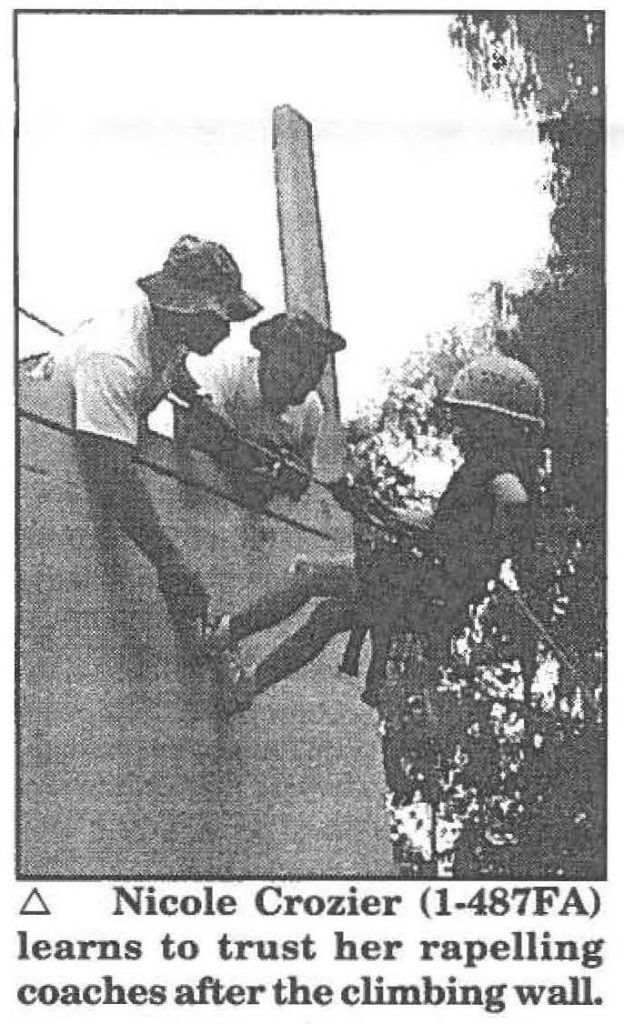 Nicole Crozier (1-487FA) learns to trust her rappelling coaches after the climbing wall.