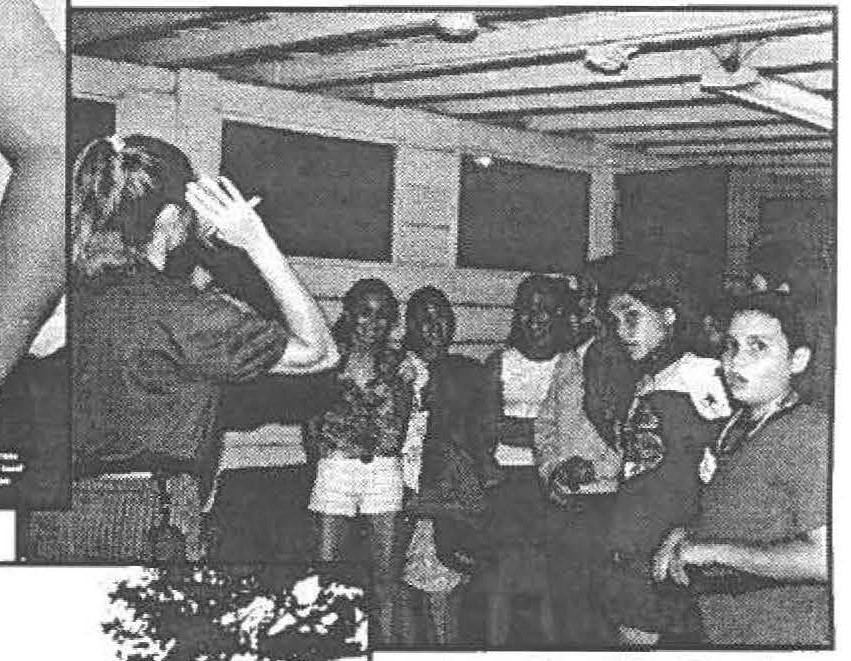 Charla Lesher (1-487FA) and Elizabeth Badley (154CF) and the other female trainees bunking in "the Stables" stand amazed at what the camp director is telling them ... "We have bunk inspections every day?!?''