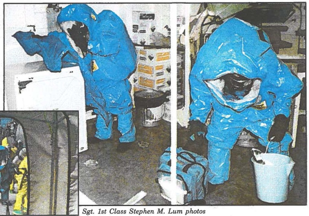 NAVALRECON-93rd Civil Support Team reconnaissance personnel probe the laundry room of the USS Hopper for the traces decontaminates at the Pearl Harbor dock and later rinse off on-shore.