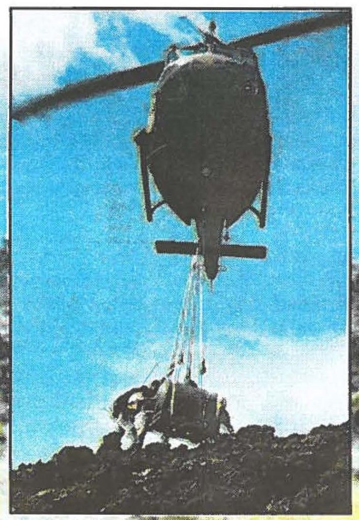 RESTORING ENDANGERED SPECIES -- A Hawaii Army Guard vintage UH-lH Iroquois "Huey" helicopter sling-loading a 125-gallon tank of water to Kanaio. Melissa Dumaran photos