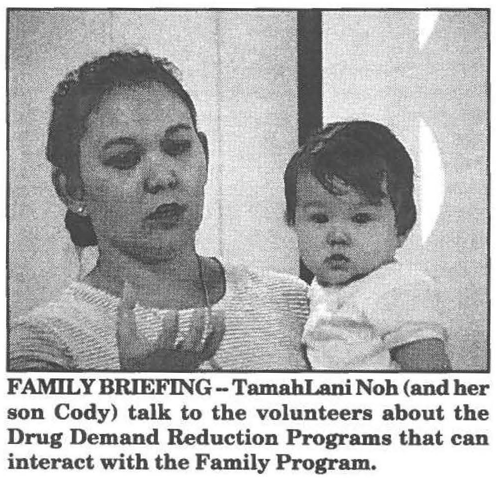 FAMILY BRIEFING- TamabLaoi Noh (and her son Cody) talk to the volunteers about the Drug Demand Reduction Programs that can interact with the Family Program.