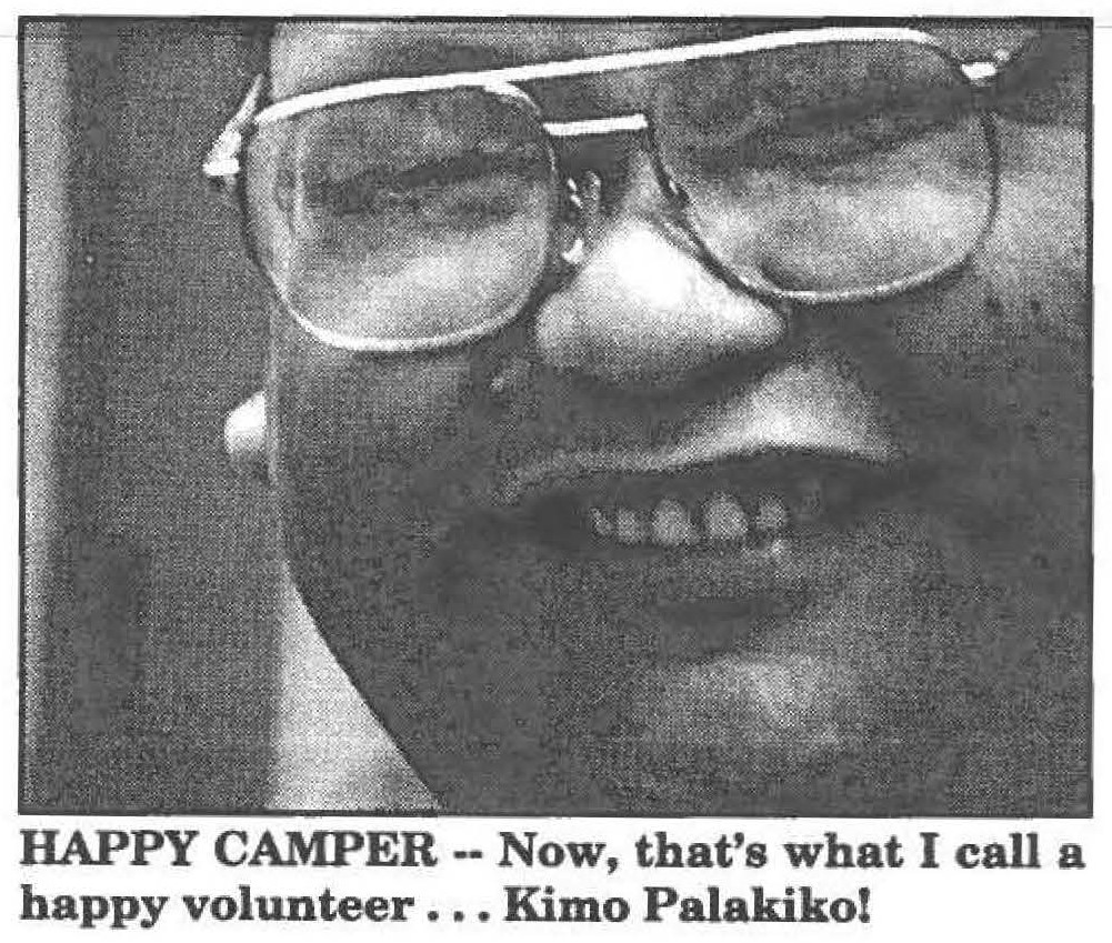 HAPPY CAMPER -- Now, that's what I call a happy volunteer ... Kimo Palakiko!