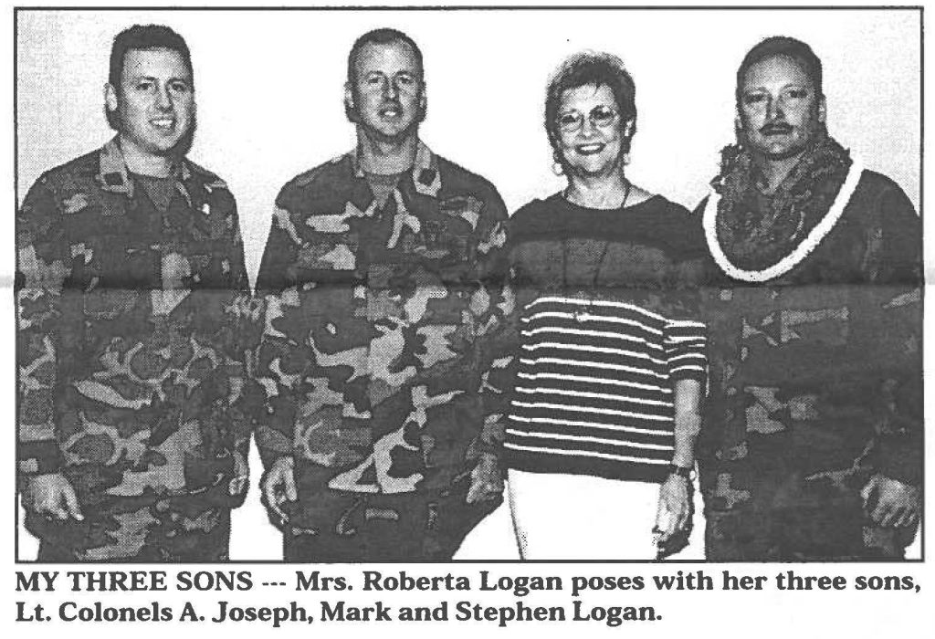MY THREE SONS --- Mrs. Roberta Logan poses with her three sons, Lt. Colonels A. Joseph, Mark and Stephen Logan.