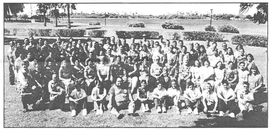 The beautiful setting for this year's conference is shown when the family member volunteers, youth representatives and command pose for the traditional group shot.