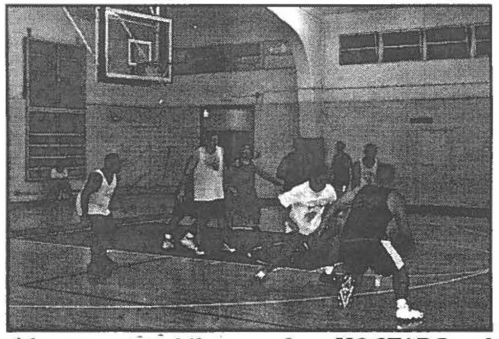 HOOP DREAMS -- teams from HQ ST ARC and 1st Battalion, 487th Field Artillery, trade baskets.