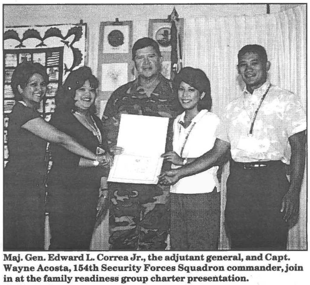 Maj. Gen. Edward L Correa Jr., the adjutant general, and Capt. Wayne Acosta, 154th Security Forces Squadron commander, join in at the family readiness group charter presentation.