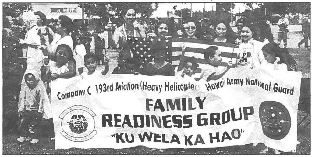 SAFE JOURNEY - KU WELA KA HAO, Company C, 193rd Aviation's family readiness group (below) sends their Aloha to their departing loved ones at the activation ceremony held a few days before the heavy lift CH-4 7D Chinook helicopter unit left for a year-long mission in Iraq. Master Sgt. Stephen M. Lum photo