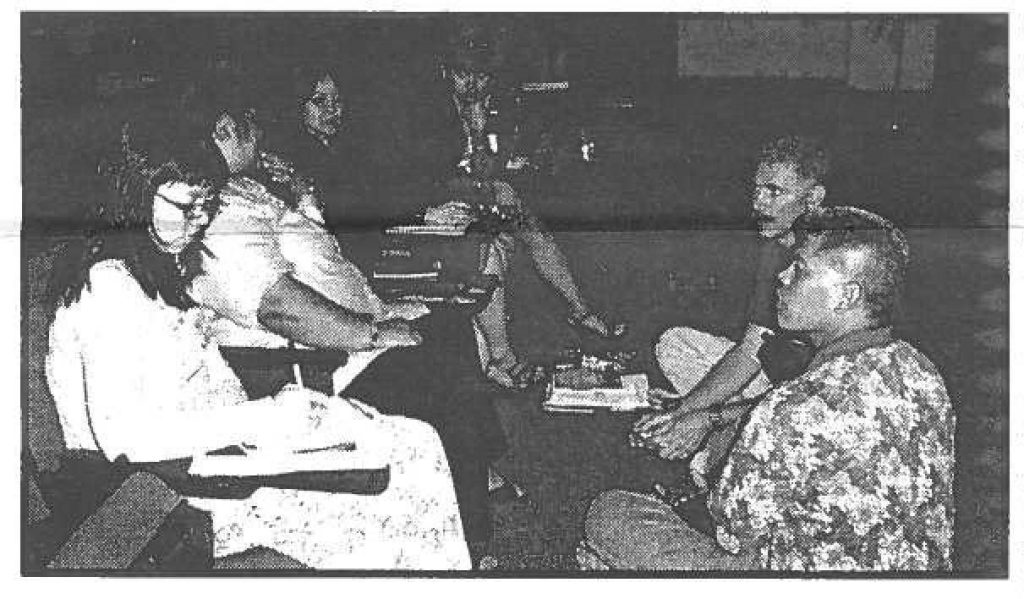 TRAINING'N' TREATS Family Readiness conferees meet in small groups to brainstorm resolutions to support those who are deployed and those left at home. Meetings and dining were held at 298th Regional Training Institute, Bellows Air Force Station in Waimanalo.
