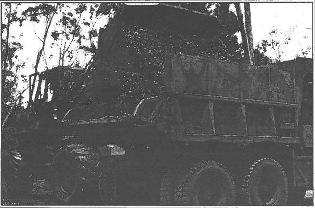 WEEDING -- The Hawaii Army National Guard's 227th Engineering Company uses a front end scoop loaders to remove salvinia molesta from wahiawa's Lake Wilson into five-ton dump trucks.