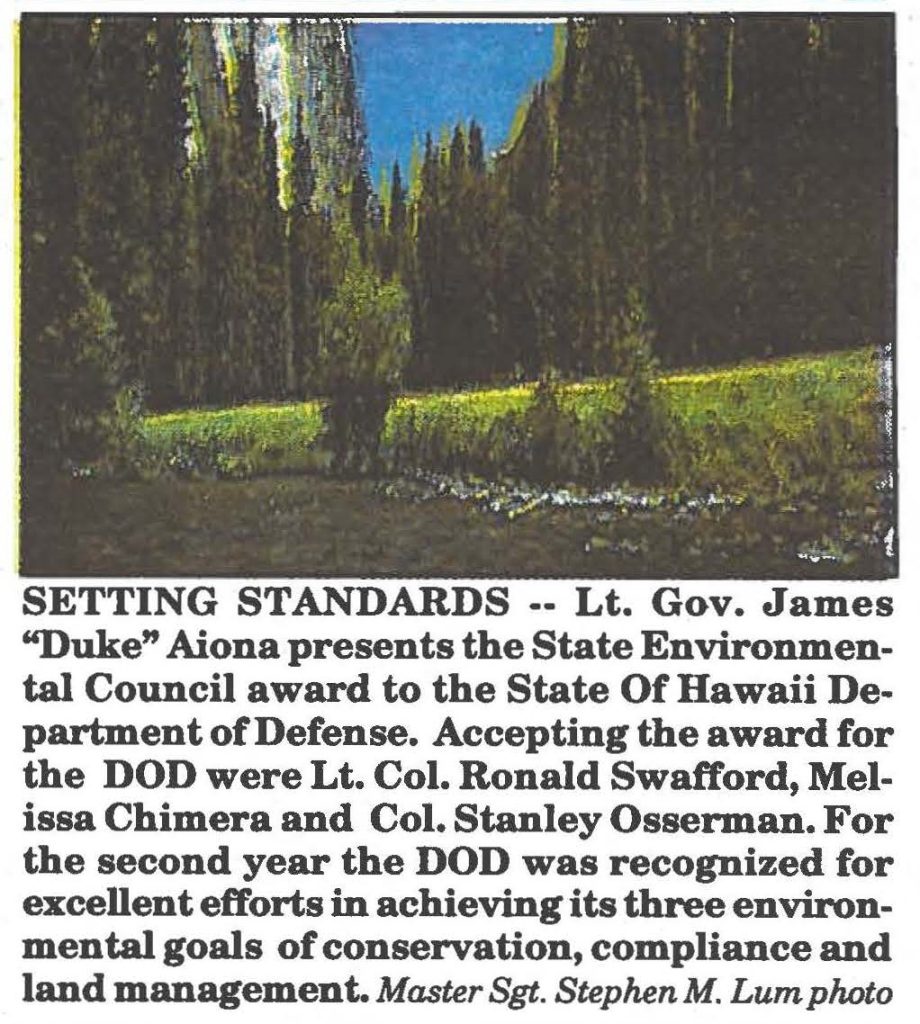 SETTING STANDARDS -- Lt. Gov. James "Duke" Aiona presents the State Environmental Council award to the State Of Hawaii Department of Defense. Accepting the award for the DOD were Lt. Col. Ronald Swafford, Melissa Chimera and Col. Stanley Osserman. For the second year the DOD was recognized for excellent efforts in achieving its three environmental goals of conservation, compliance and land management. Master Sgt. Stephen M. Lum photo