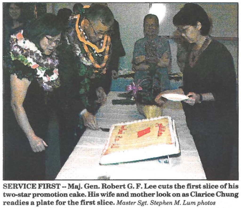 SERVICE FIRST-- Maj. Gen. Robert G. F. Lee cuts the first slice of his two-star promotion cake. His wife and mother look on as Clarice Chung readies a plate for the first slice. Master Sgt. Stephen M. Lum photos