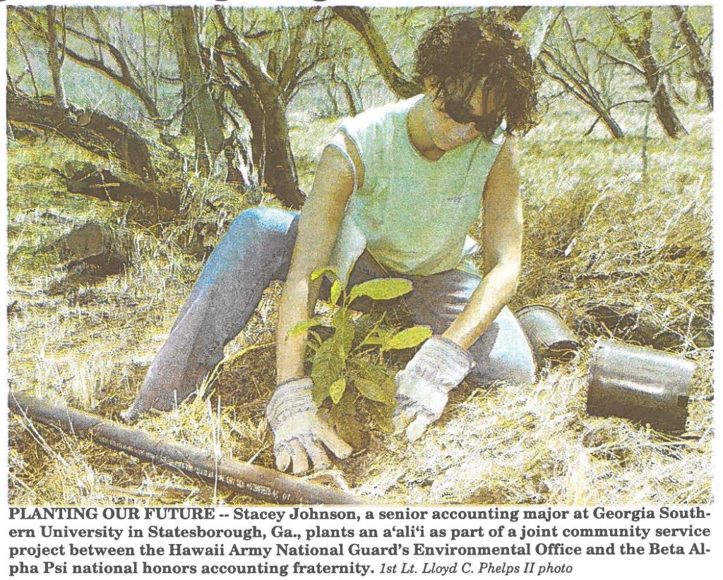 PLANTING OUR FUTURE -- Stacey Johnson, a senior accounting major at Georgia Southern University in Statesborough, Ga., plants an a'ali'i as part of a joint community service project between the Hawaii Army National Guard's Environmental Office and the Beta AIpha Psi national honors accounting fraternity. 1st Lt. Lloyd C. Phelps II photo