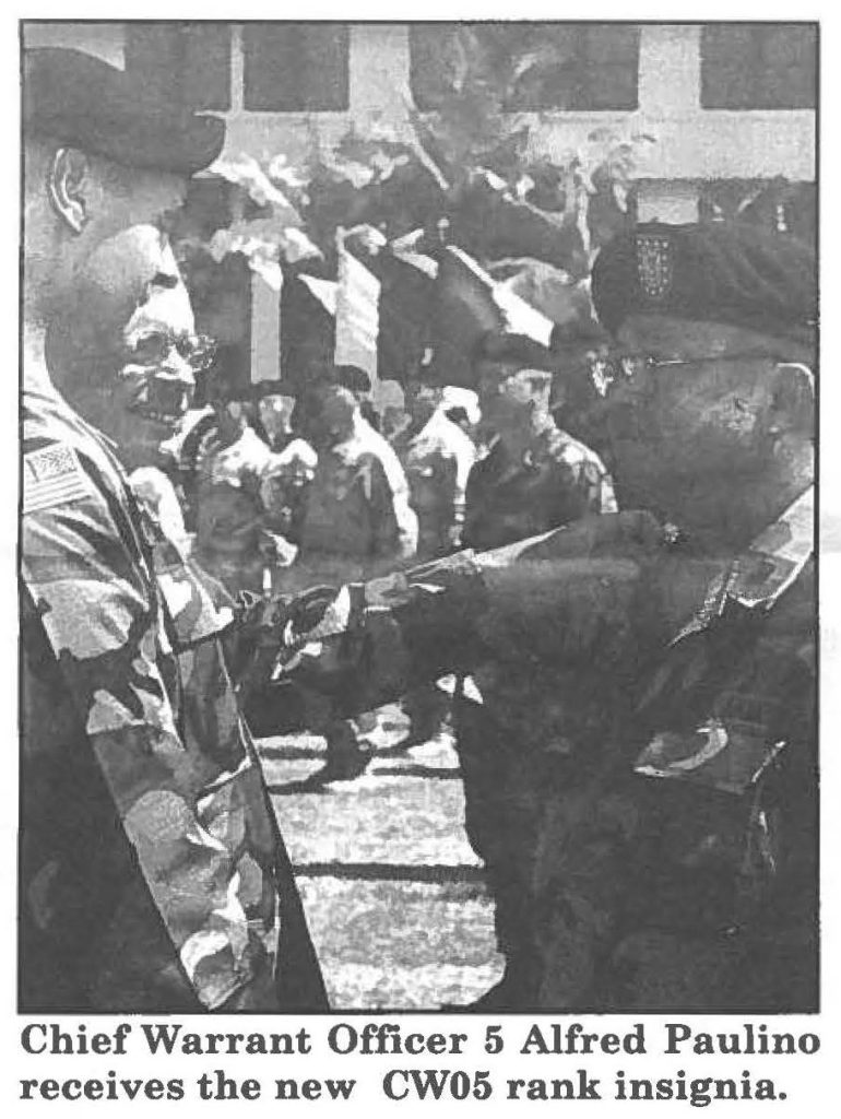 Chief Warrant Officer 5 Alfred Paulino receives the new CW05 rank insignia.