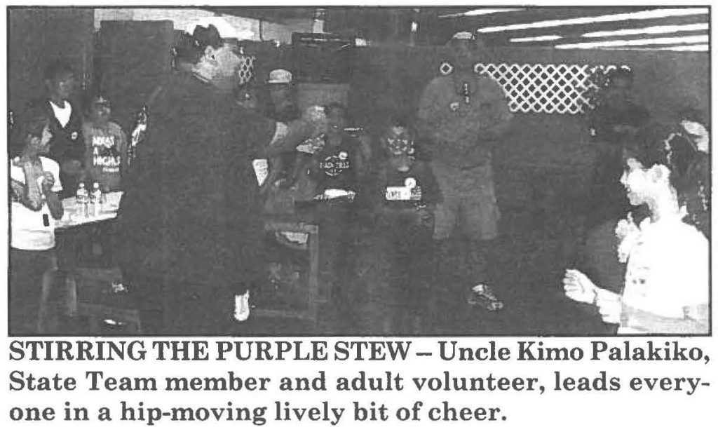 STIRRING THE PURPLE STEW - Uncle Kimo Palakiko, State Team member and adult volunteer, leads everyone in a hip-moving lively bit of cheer.
