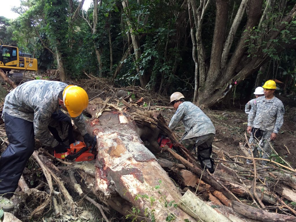 Maui island based Hawaii National Guard Airmen and Soldiers work to remove debris from the Wailuku river September 2016. Storm generated heavy rains on Sep. 13th caused river swelling and flash flooding impacting area residents and damaging property and infrastructure. The service members volunteered for state active duty from Sep. 21 to Sep. 27 for domestic operations to provide humanitarian asistance. (courtesy photo)