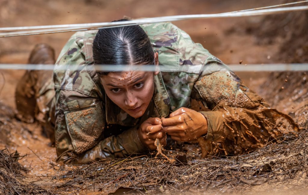 Sgt. Haleigh A. Romero of the 777th Aviation Support Battalion, maneuvering through an obstacle in her timed run through the obstacle course during the 2020 Best Warrior Competition held at Schofield Barracks from March 6-8, 2020. The Best Warrior will receive the opportunity to represent the Hawaii Army National Guard at the Regional level. (U.S. Army National Guard photo by Sgt. John Schoebel)