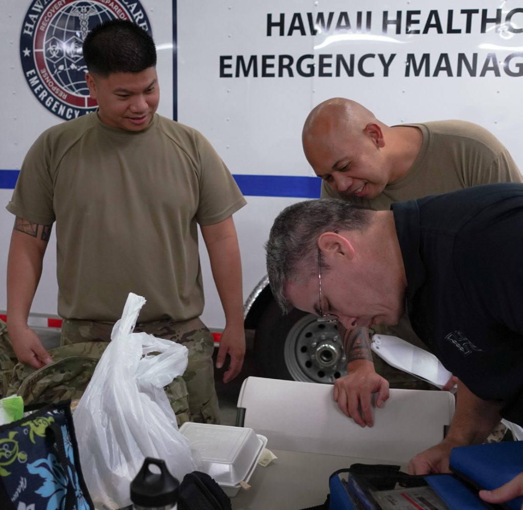 Staff Sgt. Joey Paulino (left) and Master Sgt. Cicernesto Zausa (right), Medical logistics Airmen with Hawaii Air National Guard, Medical Detachment 1, witness the operational check of a ventilator at the Hawaii Healthcare Emergency Management Coalition in preparation for the piece of vital equipment to be distributed to a requesting Hawaii medical facility, March 25, 2020, Honolulu Hawaii. (U.S. Air National Guard photo by Tech. Sgt. Andrew Jackson)