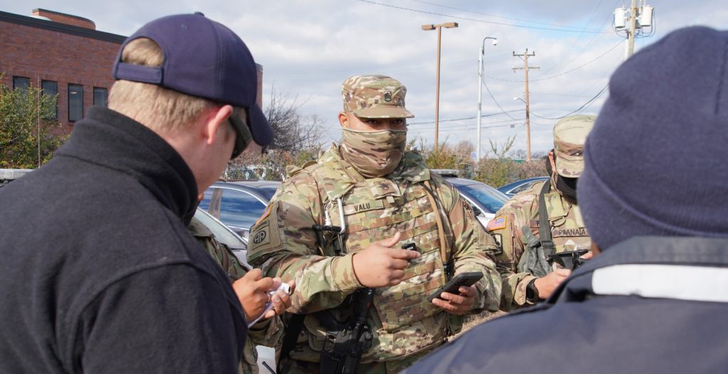 U.S. Army Staff Sgt. Atui Valu coordinates with the Virginia State Police, Arlington, Virginia, Jan. 19, 2021. At least 25,000 National Guard men and women have been authorized to conduct security, communication and logistical missions in support of federal and District authorities leading up and through the 59th Presidential Inauguration. (U.S. Air National Guard photo by Master Sgt. Andrew Jackson)