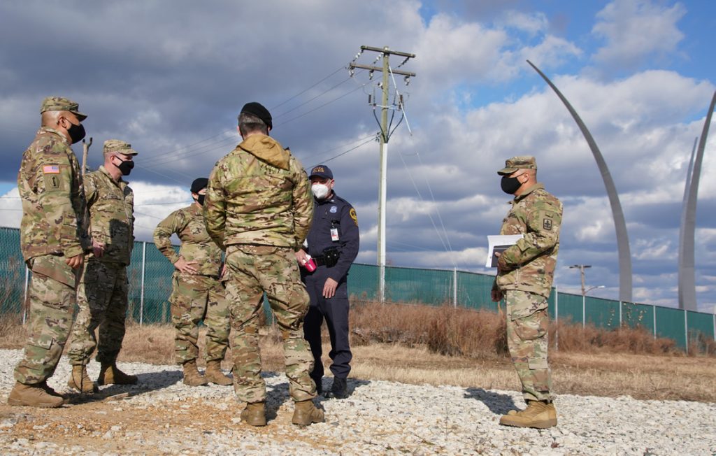 U.S. Soldiers with the Hawaii National Guard meet with Virginia State Police to finalize traffic security operations in Arlington, Virginia, Jan. 18, 2021. At least 25,000 National Guard men and women have been authorized to conduct security, communication and logistical missions in support of federal and District authorities leading up and through the 59th Presidential Inauguration. (U.S. Air National Guard photo by Master Sgt. Andrew Jackson)