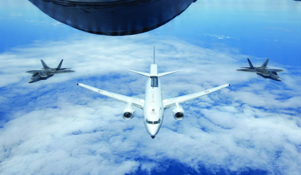 A Royal Australian Air Force E-7A Wedgetail, operated by No. 2 Squadron based at RAAF Base Williamtown, Australia, flies in formation with Hawaii Air National Guard F-22 Raptors April 21, 2021, near Oahu, Hawaii. The command-and-control aircraft, traveled to Hawaii to participate in exercise Pacific Edge 21 and provide airborne early warning support to airborne participants. The exercise was held to enhance air-combat proficiencies through the integration of allied units and further the interoperability between the two countries’ aircraft. In a unique association, the F-22s and the air defense mission at Joint Base Pearl Harbor-Hickam are assigned to the 154th Wing, Hawaii Air National Guard. The 199th Fighter Squadron and the 19th Fighter Squadron serve together under the Air National Guard-led active-associate construct to accomplish their assigned mission. (U.S. Air National Guard photo by Staff Sgt. John Linzmeier)