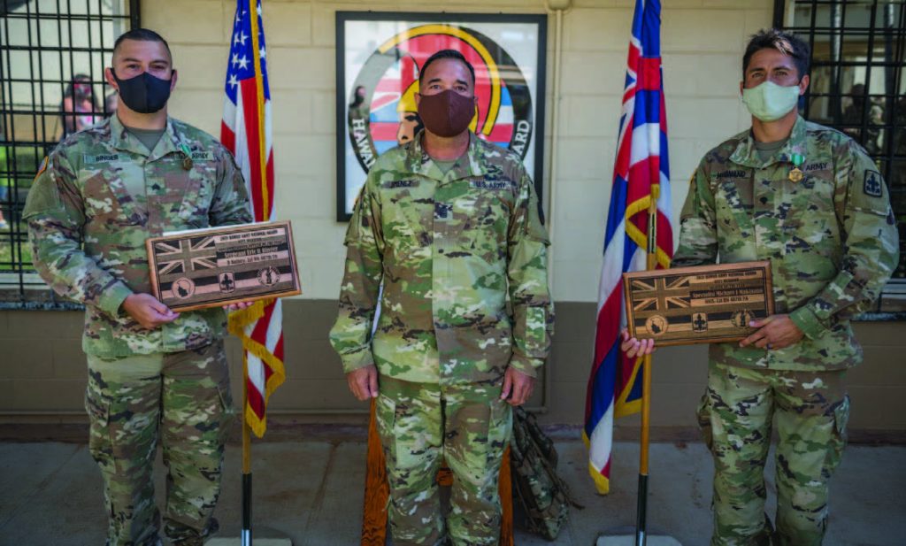 Command Sgt. Maj. James R. Jimenez, Command Sgt. Maj., Hawaii Army National Guard (HIARNG) stands with the 2021 HIARNG Best Warrior competition winners Sgt. Eric R. Binger and Spc. Michael J. Makinano after they received their awards, April 10, 2021, Kapolei, Hawaii. Both winners earned the opportunity to compete in the regional level competition later in the year. (U.S. Army National Guard photo by Sgt. John Schoebel)