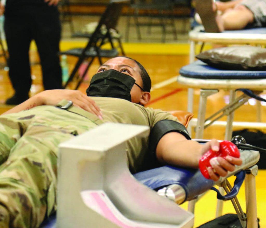 Hawaii Army National Guard (HIARNG) Soldier Spc. Florani Camacho, an Automated Logistical Specialist with Bravo Company, 1109th Theater Aviation Sustainment Maintenance Group prepares to get blood drawn during the blood drive, Honolulu, Hawaii, June 12, 2021. Soldiers volunteer in support of the event driven by the HIARNG, the Hawaii Building & Construction Trades Council and the Blood Bank of Hawaii. (U.S. Army National Guard Photo by Spc. Mariah-Alexsandra Manandic-Kapu)