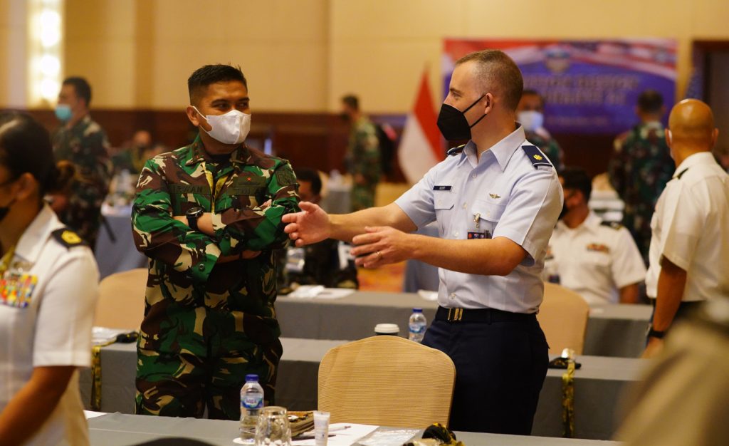 Maj. Gregory Scott, Hawaii Air National Guard, interacts with his counterpart for the operational design workshop portion of Exercise GEMA BHAKTI, Sept. 16, 2021, Jakarta Indonesia. The operational design workshop in the precursor exercise for Exercise GEMA BHAKTI and is facilitated by the Hawaii National Guard with the Tentara Nasional Indonesia (TNI) as a part of the State Partnership Program. (U.S. Air National Guard photo by Master Sgt. Andrew Jackson)
