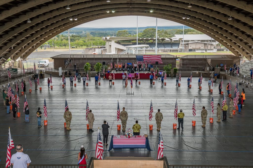 Essential workers, Hawaii National Guard members, and special guests stand in a ‘Circle of Hope’ before the playing of the National Anthem and Hawaii Pono i, in the Edith Kanakaole Stadium, July 5, 2021, Hilo Hawaii. The special ceremony was to thank the National Guard, Hawaii Police Department, Hawaii Fire Department, Hawaii County Civil Defense, Department of Health, and first responders for their continued commitment and effort in the fight against the COVID-19 Pandemic in the County of Hawaii. (U.S. Army National Guard photo by Sgt. John Schoebel)