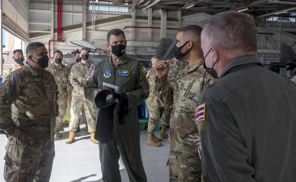 U.S. Air Force Lt. Gen. Michael A. Loh, center, director, Air National Guard, receives a briefing from members of the 154th Aircraft Maintenance Squadron, Hawai‘i National Guard, Feb. 8, 2022, at Joint Base Pearl Harbor-Hickam, Hawai‘i. The event served as an opportunity for commanders to speak openly and freely about their unit’s roles, achievements, challenges and growth trajectory. (U.S. Air National Guard photo by Master Sgt. Mysti Bicoy)
