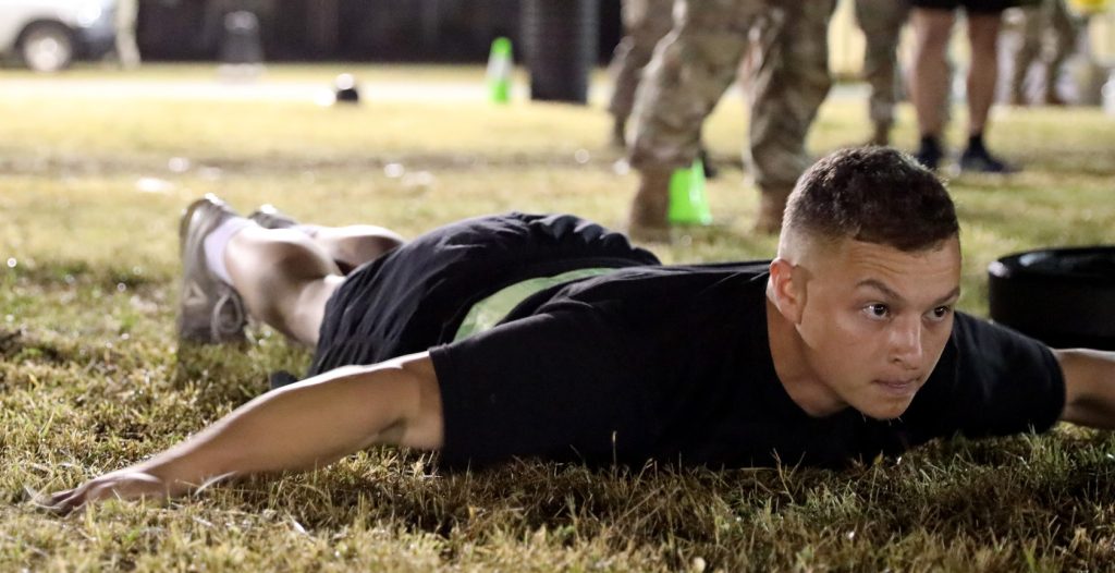 Hawai‘i Army National Guard (HIARNG) Soldier, Sgt. Trevor J. Castro, a helicopter repairer with Detachment 1, Charlie Company, 1st Battalion, 183rd Aviation Regiment, 103rd Troop Command, performs the hand-release push-up (HRPU) part of the Army Combat Fitness Test (ACFT) event during the annual Best Warrior Competition (BWC), Regional Training Institute (RTI), Waimanalo, Hawai‘i, March 4, 2022. The HRPU measures upper and lower body explosive power, flexibility and dynamic balance assisting with tasks like a buddy drag, throwing a hand grenade and employing progressive levels of force in man-to-man contact. (U.S. Army National Guard photo by Spc. Bethany J. Cravalho)