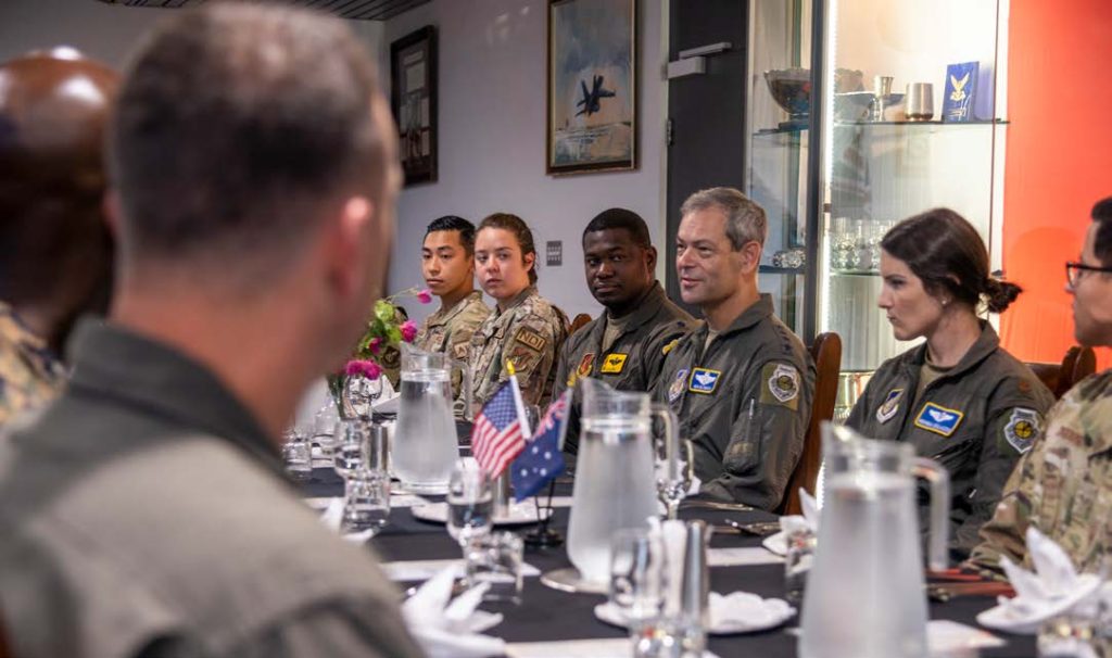 U.S. Air Force Gen. Kenneth Wilsbach, Pacific Air Forces commander, dines with Dynamic Force Employed service members at the Royal Australian Air Force Base Tindal Officer Mess Facility, Northern Territory, Australia, Sept. 4, 2022. We look for every opportunity to train alongside our allies and partners to enhance interoperability and bolster our collective ability to support a free and open Indo-Pacific. (U.S. Air National Guard photo by Master Sgt. Mysti Bicoy)