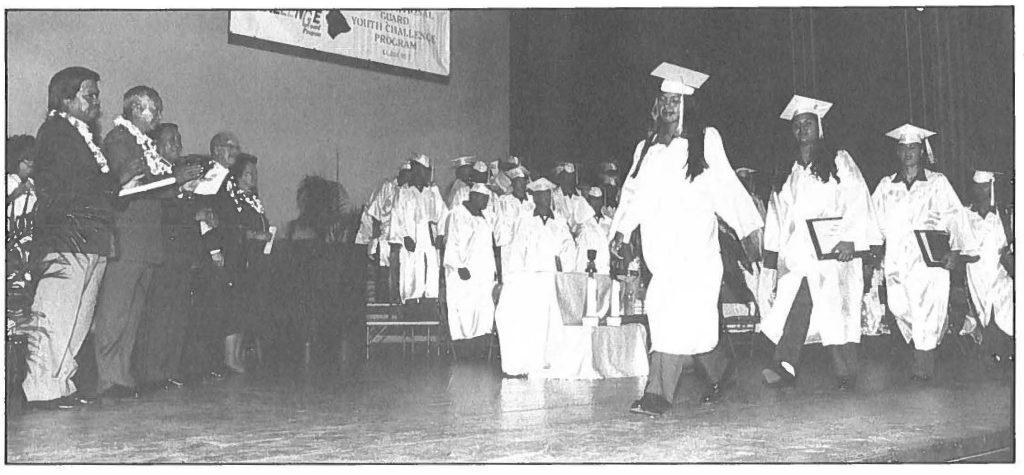 MEETING THE CHALLENGE -Gov. Benjamin J. Cayetano and Maj. Gen. Edward V. Richardson join other dignitaries, family and friends to salute the first graduating class of the Hawaii National Guard Youth Challenge Program at Castle High School's Bright Performing Arts Auditorium, Feb. 16, 1995. Sgt. 1st Class Wayne T. Iha photo
