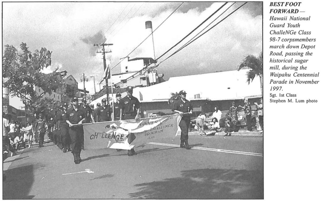 BEST FOOT FORWARD - Hawaii National Guard Youth ChalleNGe Class 98-7 corpsmembers march Down Depot Road, passing the historical sugar mill, during the Waipahu Centennial Parade in November 1997. Sgt. 1st Class Stephen M. Lum photo