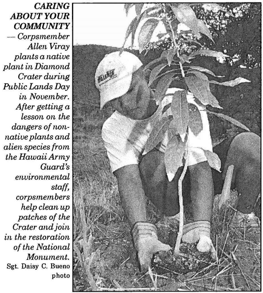 CARING ABOUT YOUR COMMUNITY – Corpsmember Allen Viray plants a native plant in Diamond Crater during Public Lands Day in November. After getting a lesson on the dangers of nonnative plants and alien species from the Hawaii Army Guard's environmental staff, corpsmembers help clean up patches of the Crater and join in the restoration of the National Monument. Sgt. Daisy C. Bueno photo