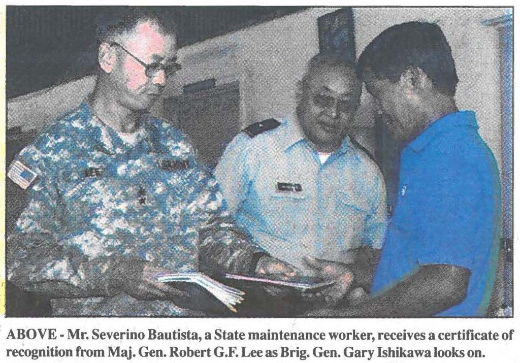 Mr. Severino Bautista, a State maintenance worker, receives a certificate of recognition from Maj. Gen. Robert G.F. Lee as Brig. Gen. Gary Ishikawa looks on