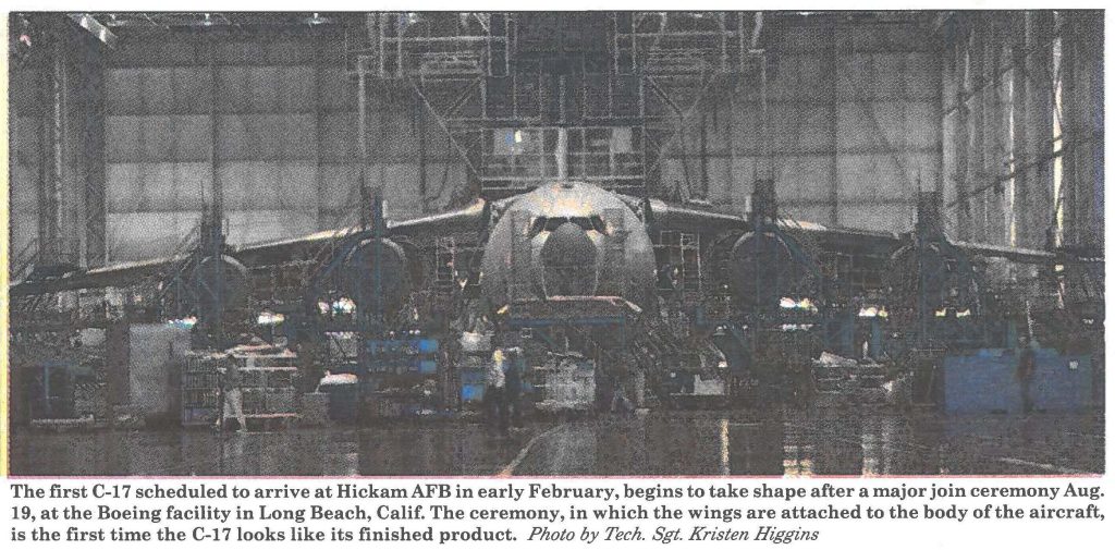 The first C-17 scheduled to arrive at Hickam AFB in early February, begins to take shape after a major join ceremony Aug. 19, at the Boeing facility in Long Beach, Calif. The ceremony, in which the wings are attached to the body of the aircraft, is the first time the C-17 looks like its finished product. Photo by Tech. Sgt. Kristen Higgins