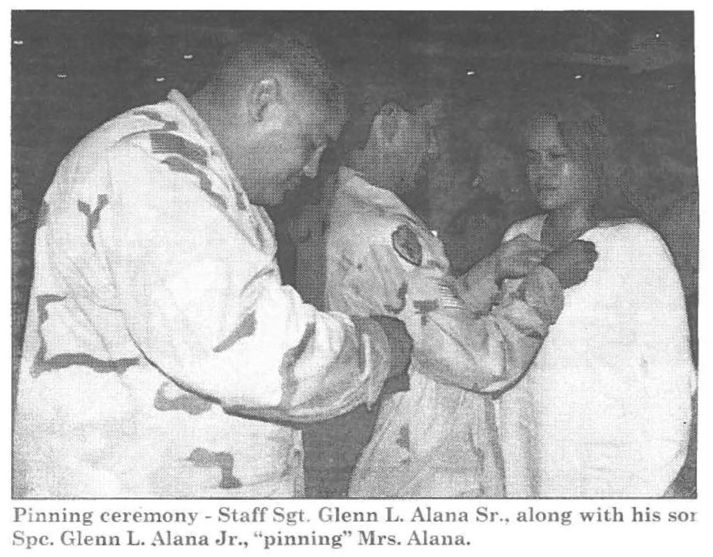 Pinning ceremony - Staff Sgt. Glenn L. Alana Sr., along with his son Spc. Glenn L. Alana Jr., 'pinning" Mrs. Alana.
