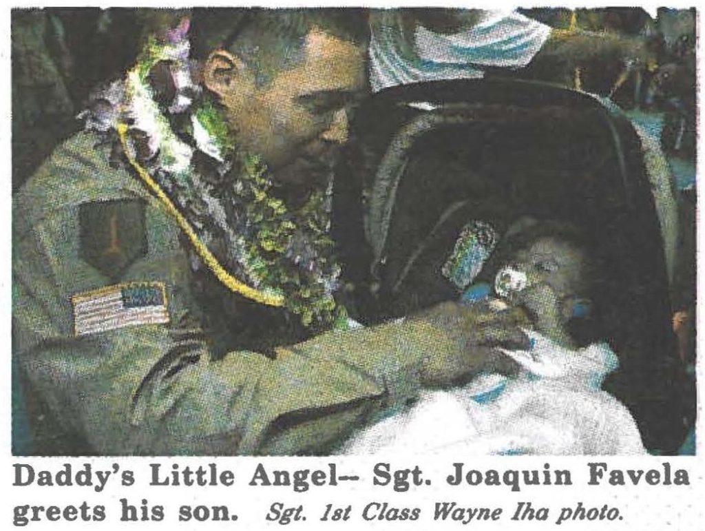 Daddy's Little Angel- Sgt. Joaquin Favela greets his son. Sgt. lst Class Wayne Iha photo.