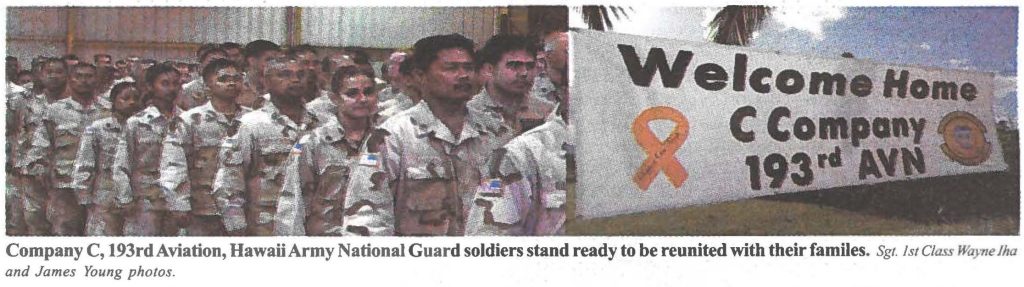 Company C, 193rd Aviation, Hawaii Army National Guard soldiers stand ready to be reunited with their fa miles. Sgt. 1st Class Wayne Iha and James Young photos.