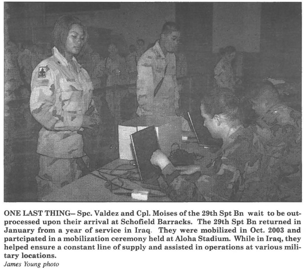 ONE LAST THING - Spc. Valdez and Cpl. Moises of the 29th Spt Bn wait to be out-processed upon their arrival at Schofield Barracks. The 29th Spt Bn returned in January from a year of service in Iraq. They were mobilized in Oct. 2003 and participated in a mobilization ceremony held at Aloha Stadium. While in Iraq, they helped ensure a constant line of supply and assisted in operations at various military locations. James Young photo