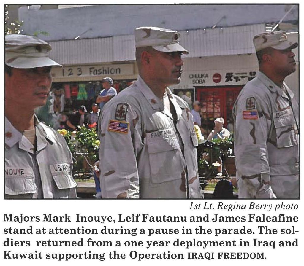 Majors Mark Inouye, Leif Fautanu and James Faleafine stand at attention during a pause in the parade. The soldiers returned from a one year deployment in Iraq and Kuwait supporting the Operation IRAQI FREEDOM.