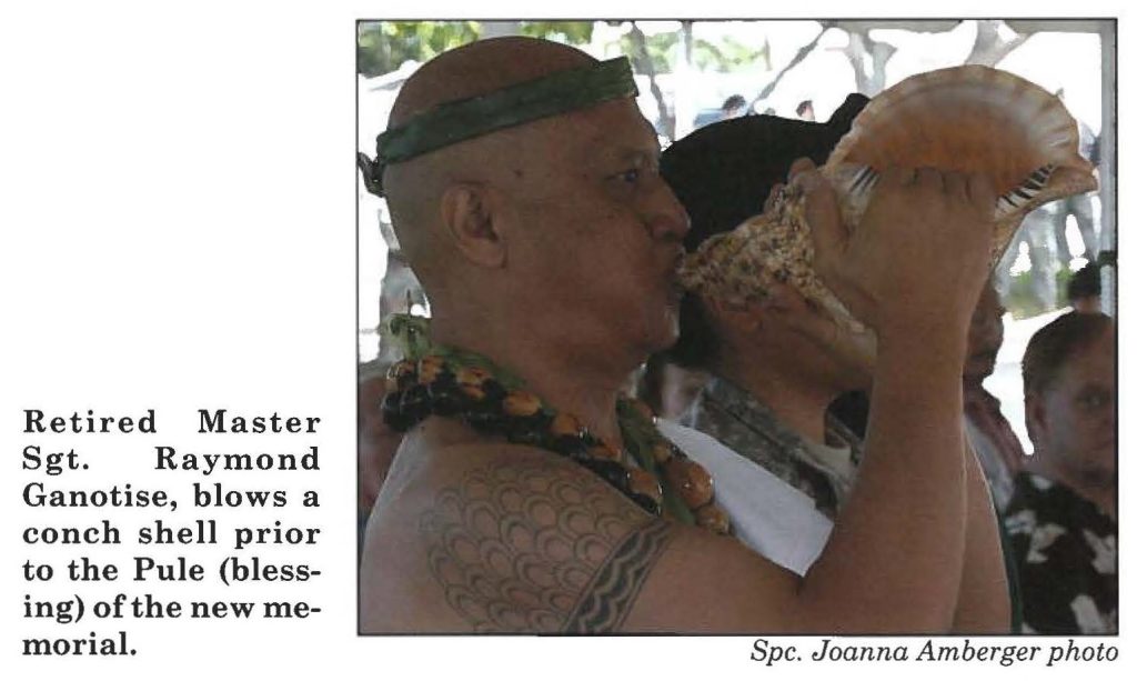 Retired Master Sgt. Raymond Ganotise, blows a conch shell prior to the Pule (blessing) of the new memorial.