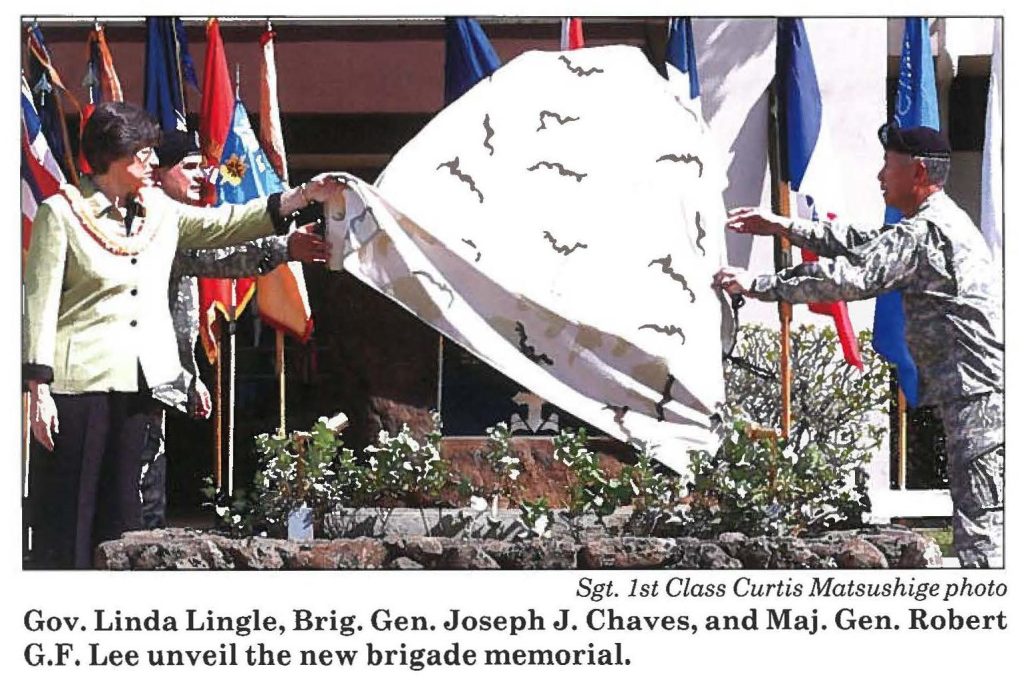 Gov. Linda Lingle, Brig. Gen. Joseph J. Chaves, and Maj. Gen. Robert G.F. Lee unveil the new brigade memorial.